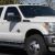 A sleek lineup of Ford cars, trucks, and SUVs parked at R&B Car Company in Warsaw, Indiana.