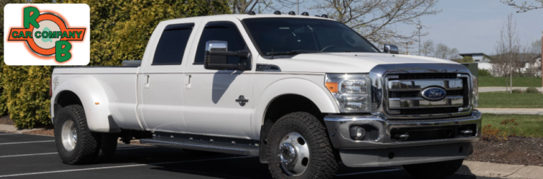 A sleek lineup of Ford cars, trucks, and SUVs parked at R&B Car Company in Warsaw, Indiana.